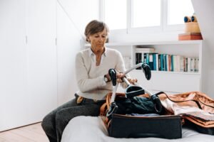 Senior traveling with wheelchair scaled