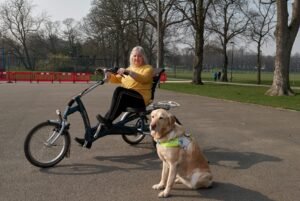 Lady in wheelchair with a service animal.