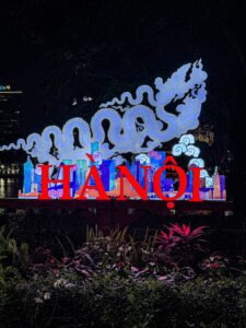 Hà Nội illuminated sign at night with dragon sculpture, Hanoi Vietnam